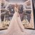 Exited about her wedding.  Full length of attractive young woman Exited about her wedding.  Full length of attractive young woman wearing wedding dress and smiling while standing in bridal shop
